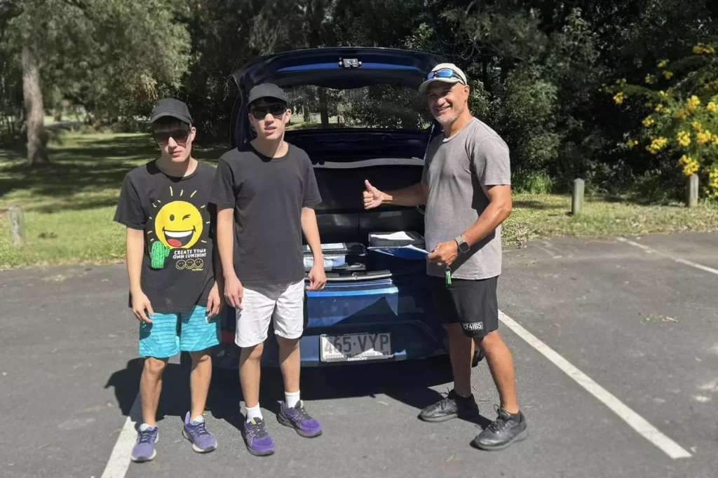 two participants are spending time outdoors with their care provider